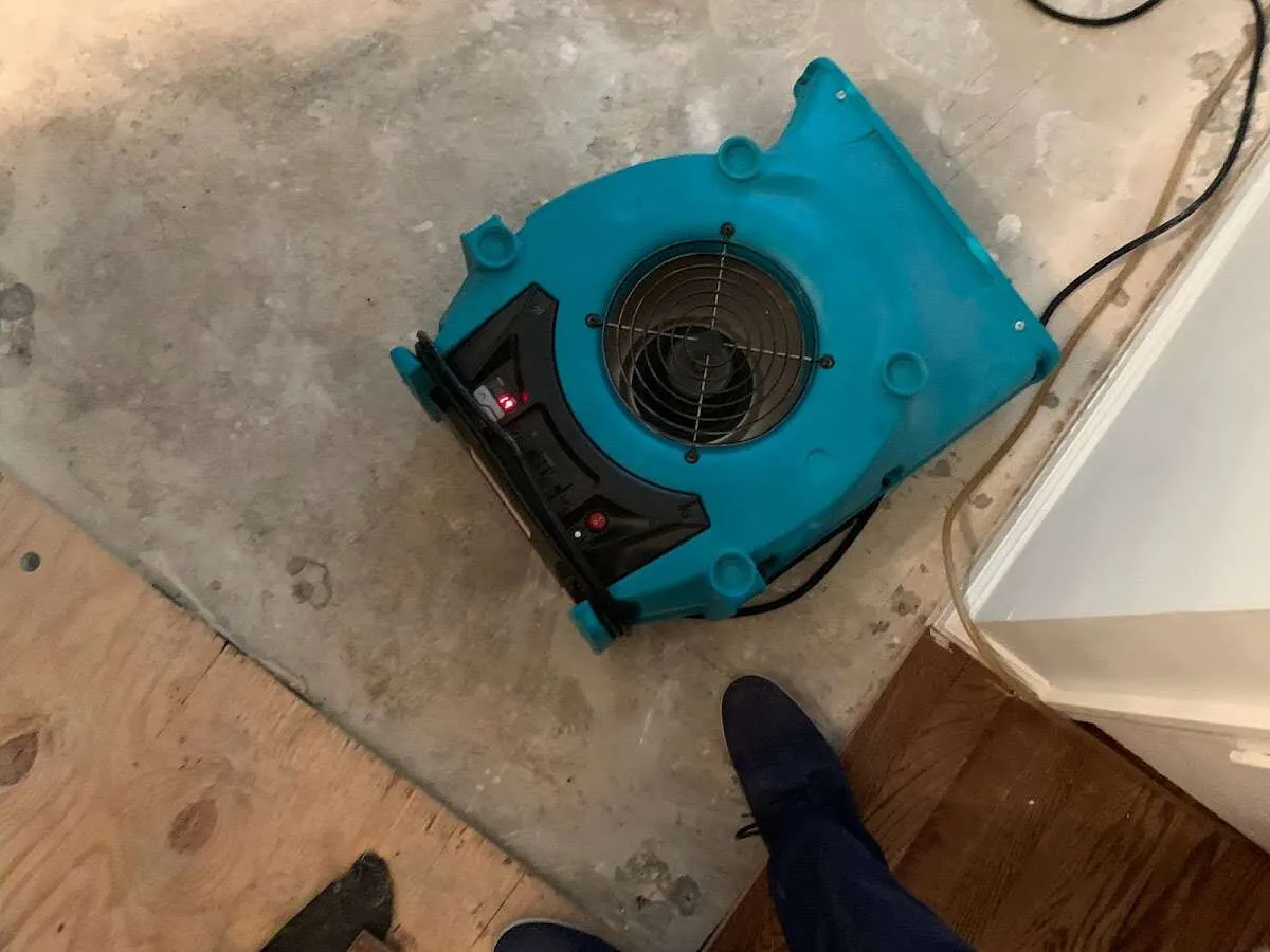 Air mover drying subfloor during Leak Detection & Repair in Tucson